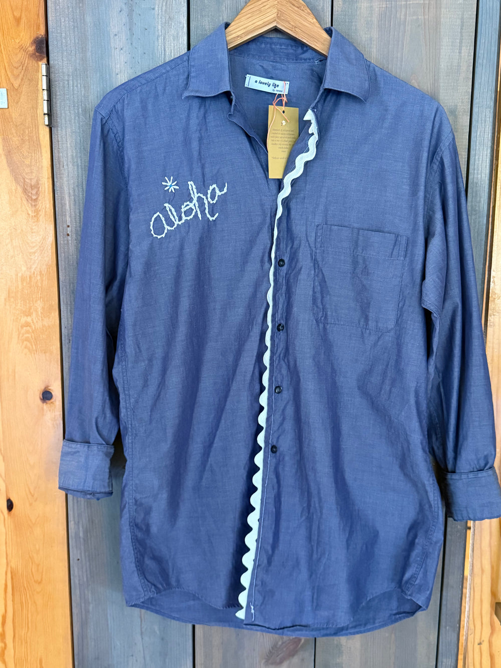Blue with White Aloha embroidered on front